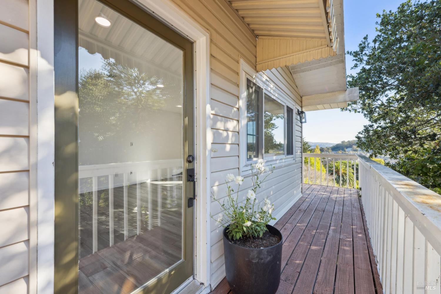 16 Dutton Court Sausalito, CA 94965 - Photo 11 of 42 a view of a balcony with wooden floor and plants