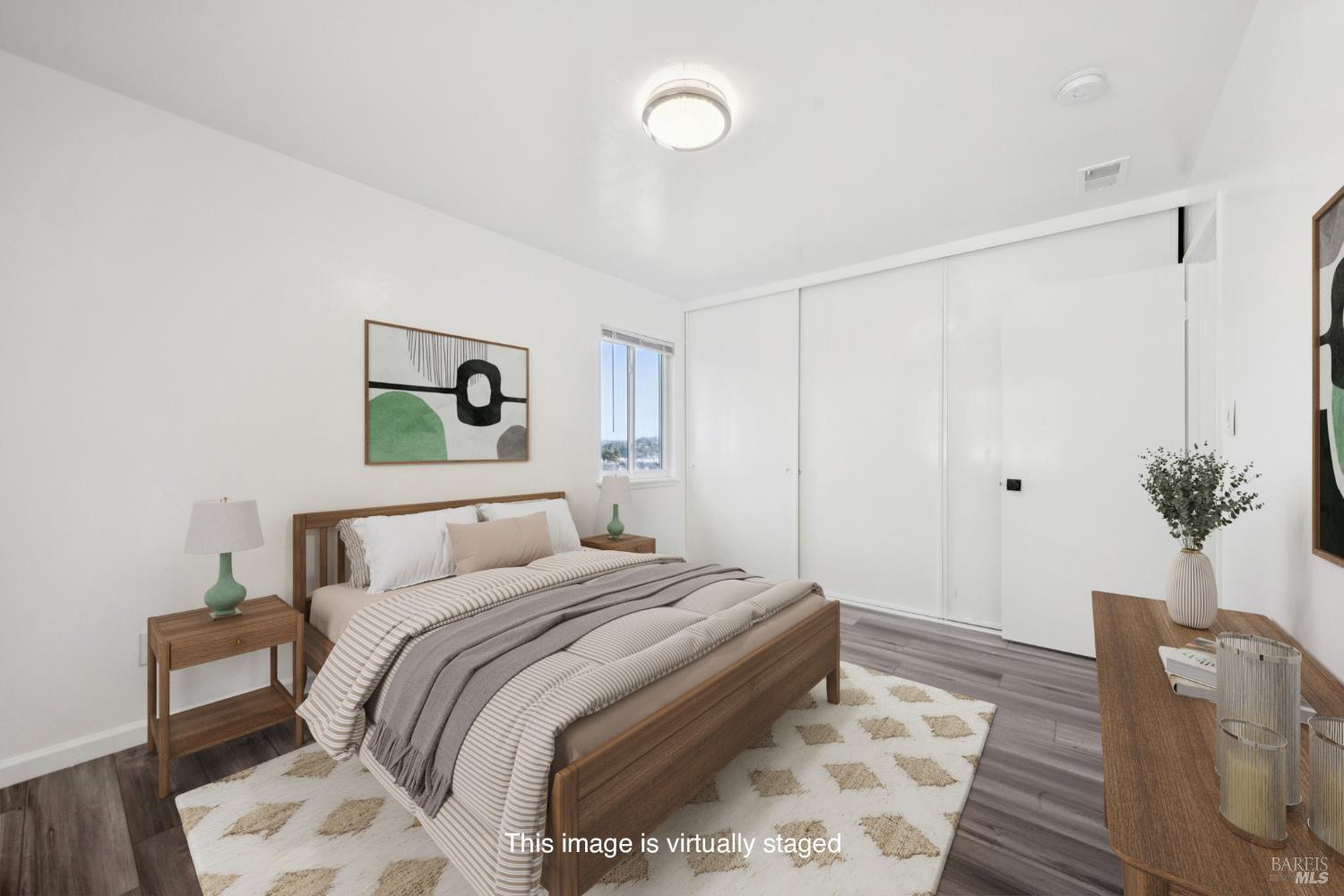 16 Dutton Court Sausalito, CA 94965 - Photo 18 of 42 a bedroom with a bed and a potted plant