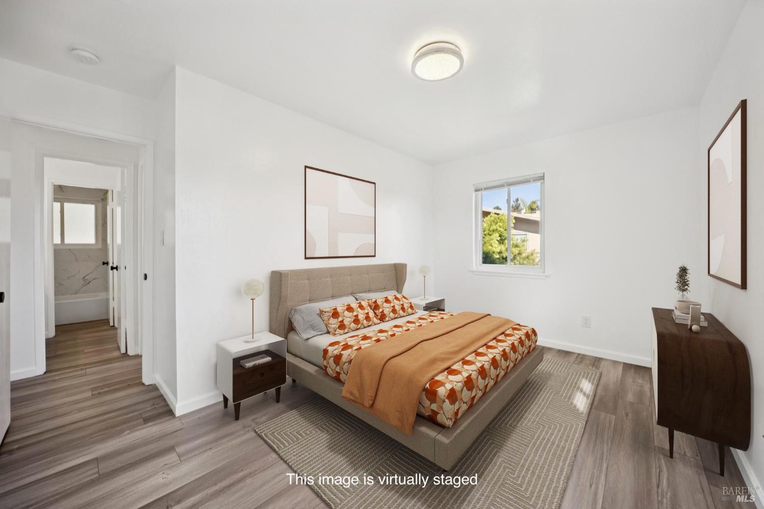 16 Dutton Court Sausalito, CA 94965 - Photo 20 of 42 a bedroom with a bed and painting on the wall