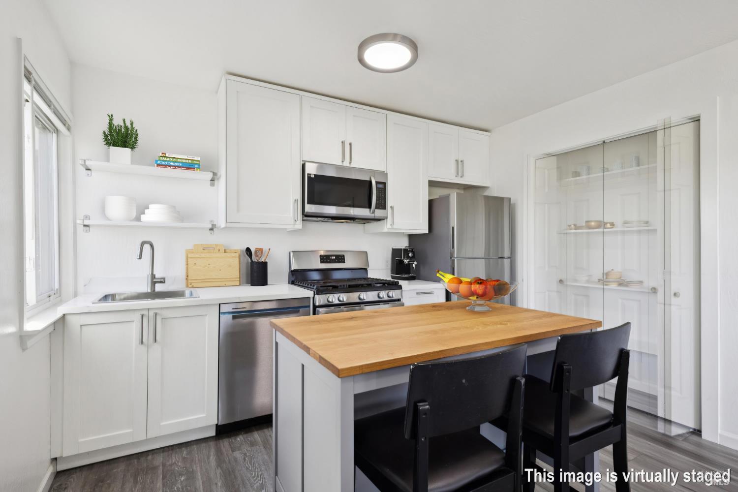 16 Dutton Court Sausalito, CA 94965 - Photo 30 of 42 a kitchen with a stove a refrigerator and a microwave