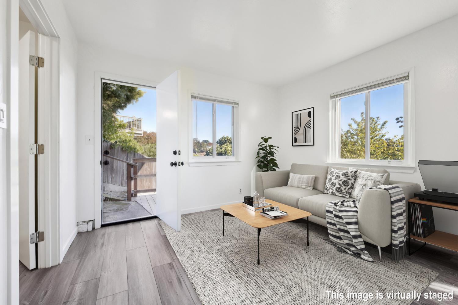 16 Dutton Court Sausalito, CA 94965 - Photo 31 of 42 a living room with furniture and a wooden floor