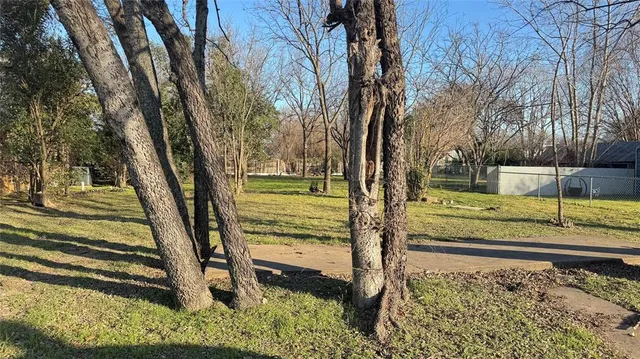 a view of a backyard of the house