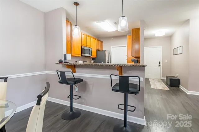 a view of kitchen with wooden floor and window