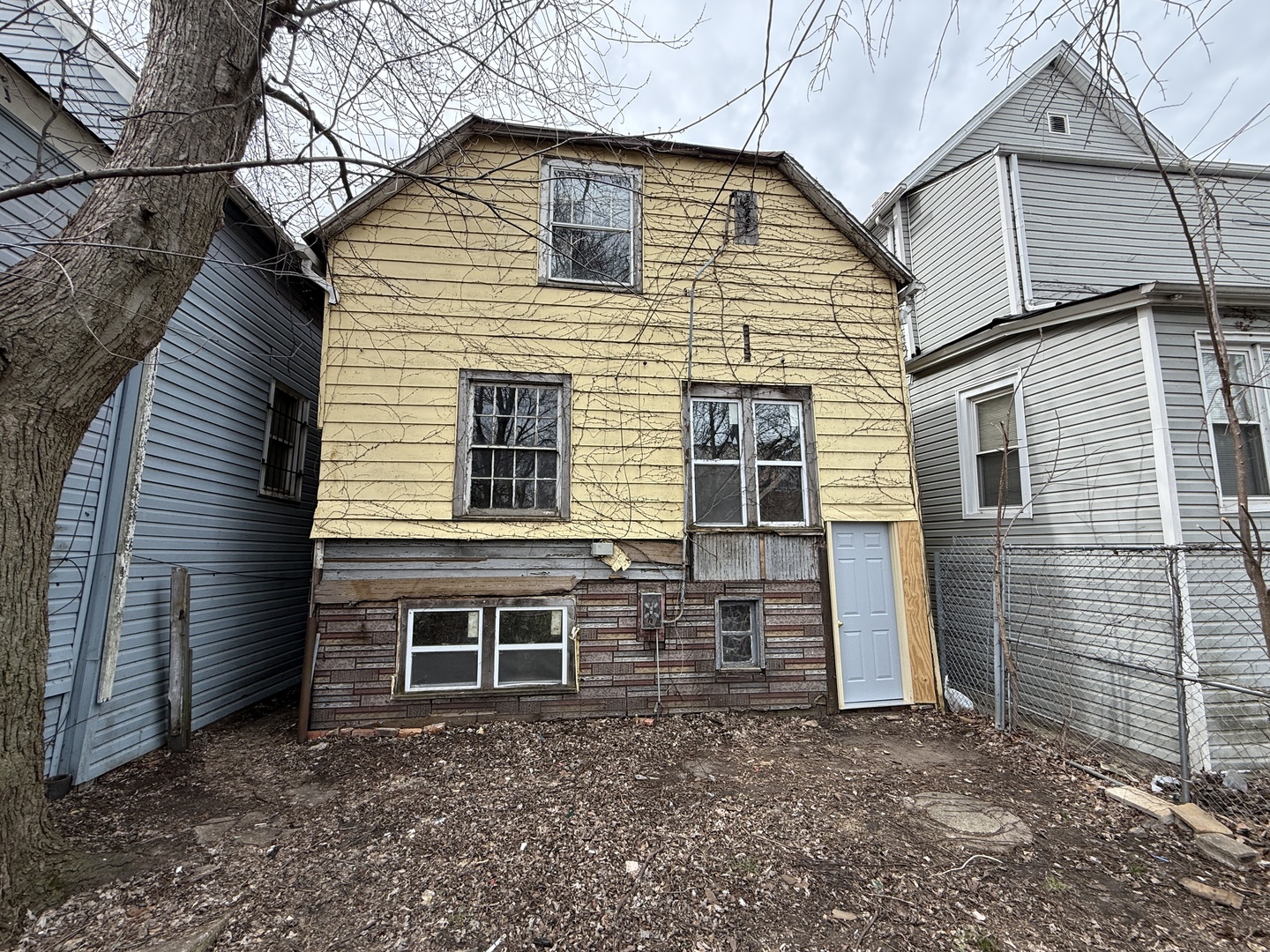 7919 South Escanaba Avenue Chicago, IL 60617 - Photo 13 of 13 a view of house with backyard