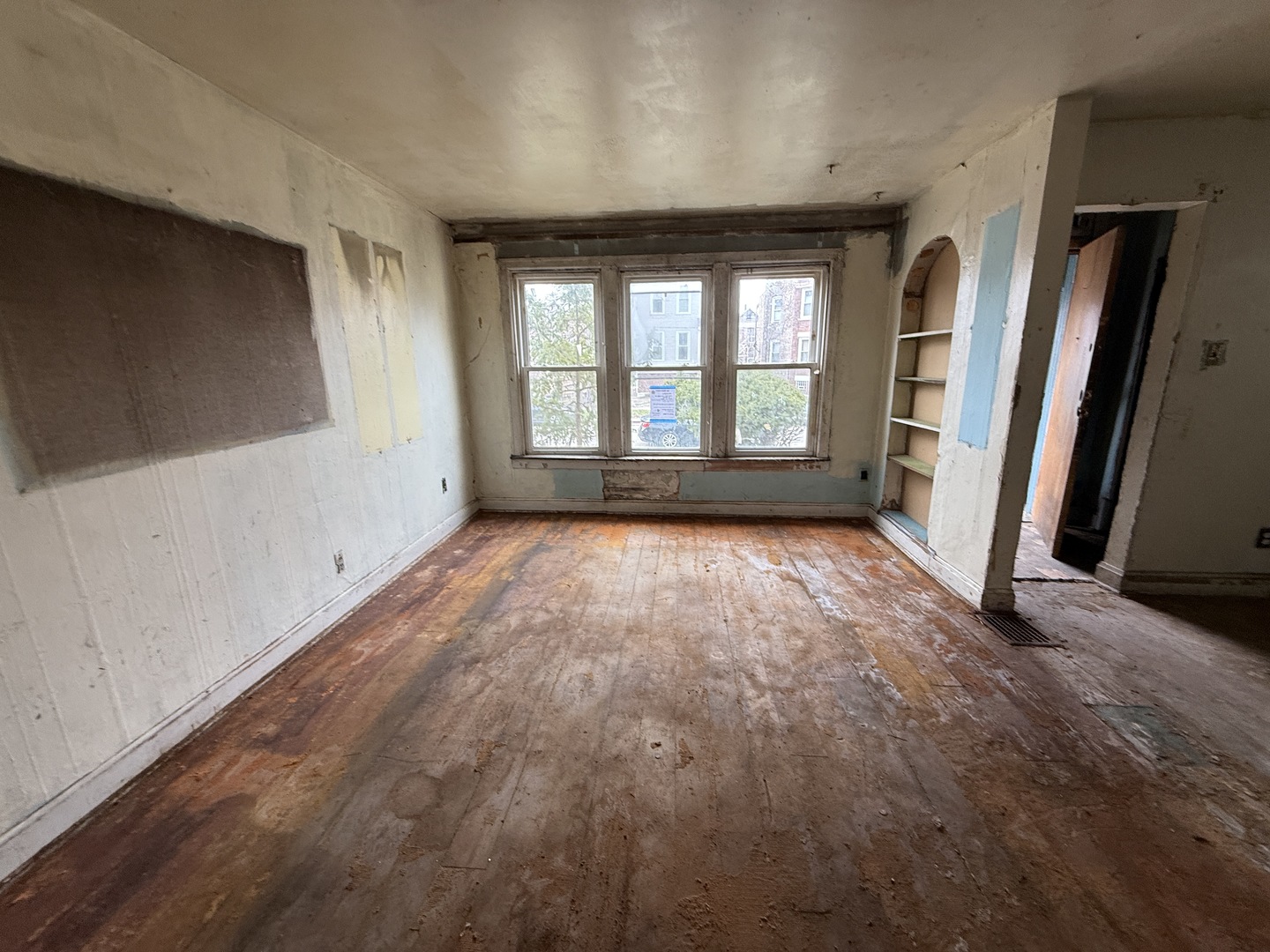 7919 South Escanaba Avenue Chicago, IL 60617 - Photo 2 of 13 a view of empty room with wooden floor and fan