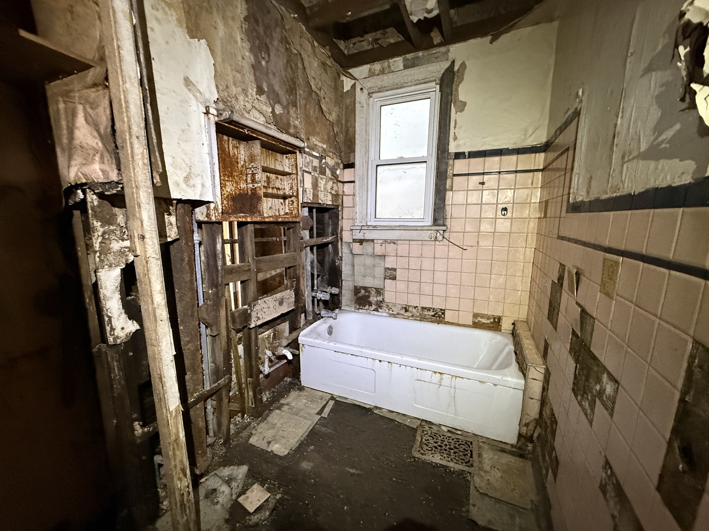 7919 South Escanaba Avenue Chicago, IL 60617 - Photo 4 of 13 a bathroom with a tub sink and a shower
