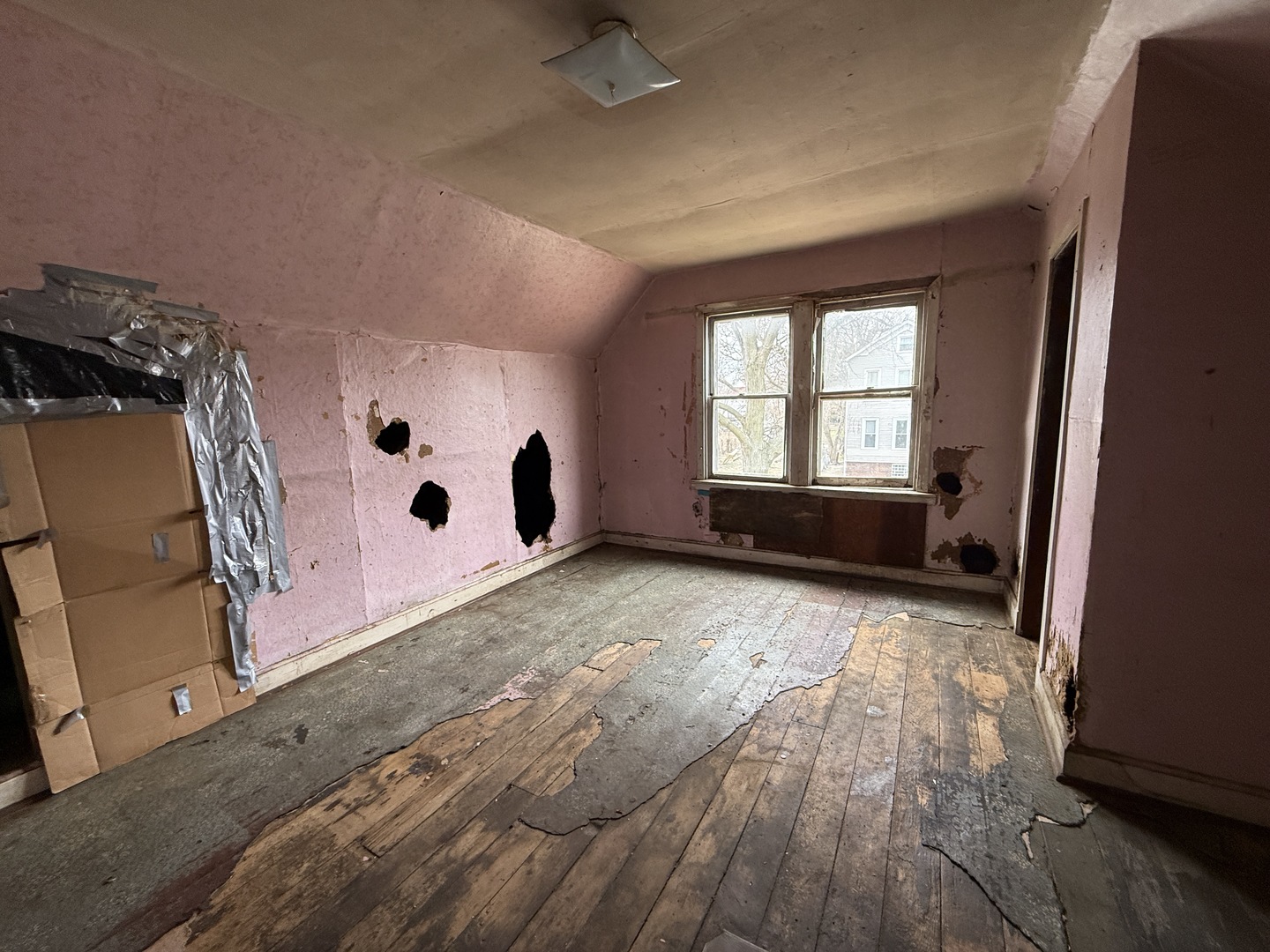 7919 South Escanaba Avenue Chicago, IL 60617 - Photo 7 of 13 a view of room with window and hardwood floor