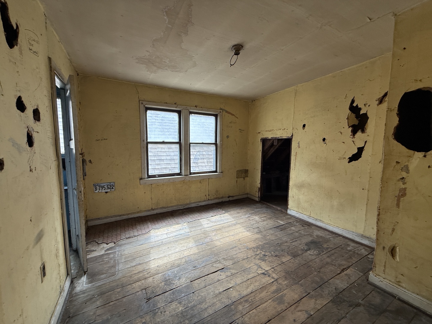 7919 South Escanaba Avenue Chicago, IL 60617 - Photo 8 of 13 an empty room with windows and closet