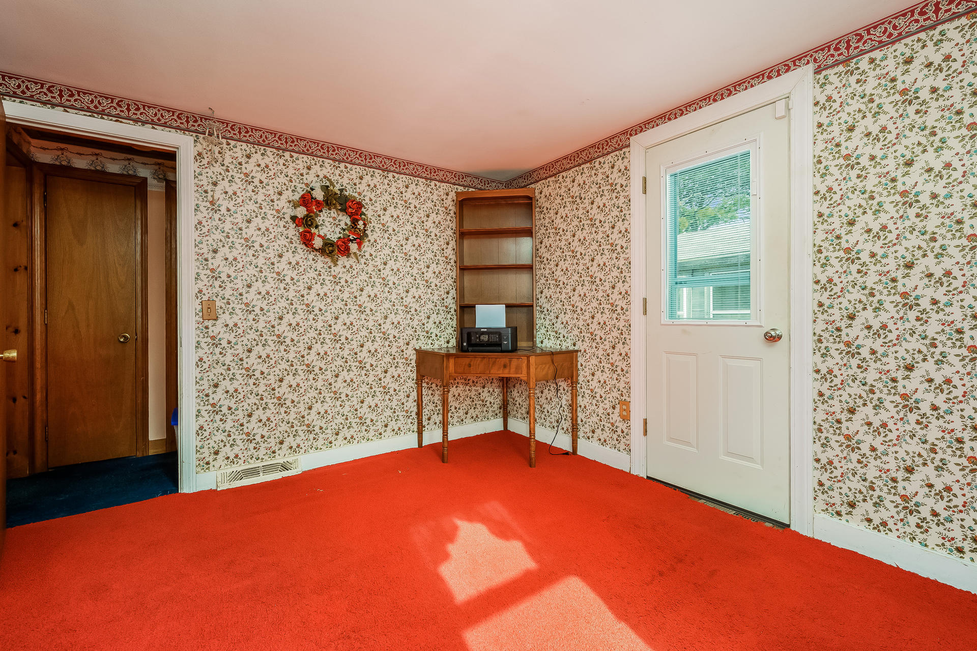 28 Lawrence Road Dennis Port, MA 02639 - Photo 19 of 20 an empty room with a door and a window