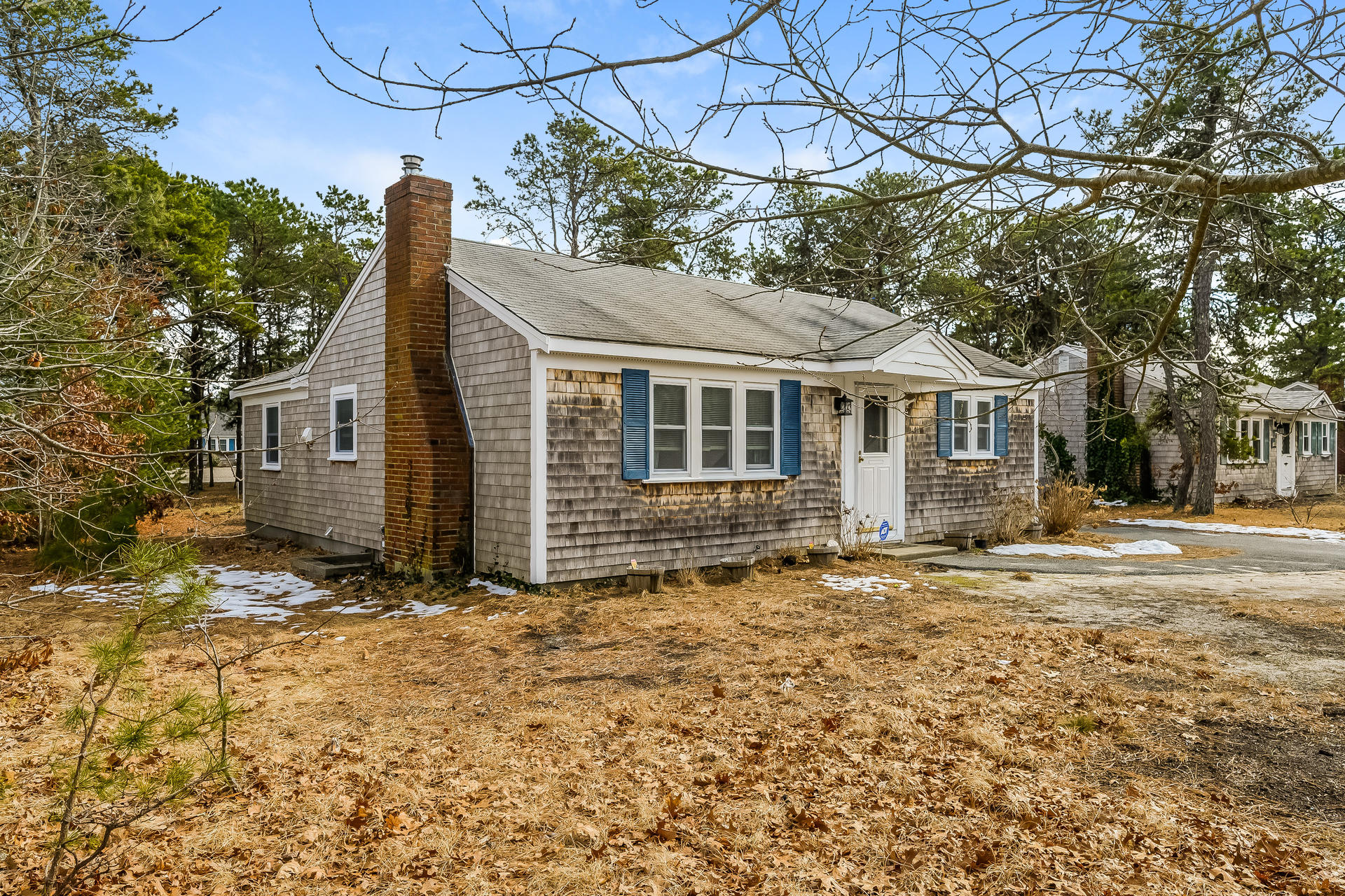 28 Lawrence Road Dennis Port, MA 02639 - Photo 2 of 20 a front view of a house with a garden