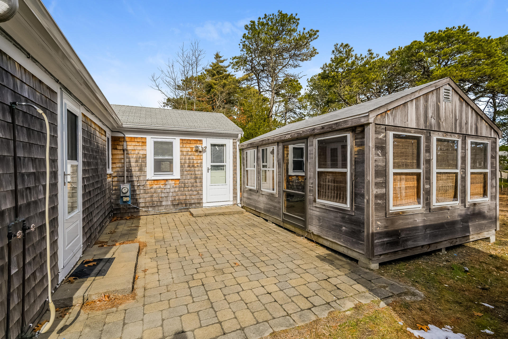 28 Lawrence Road Dennis Port, MA 02639 - Photo 4 of 20 a view of house with backyard and glass windows