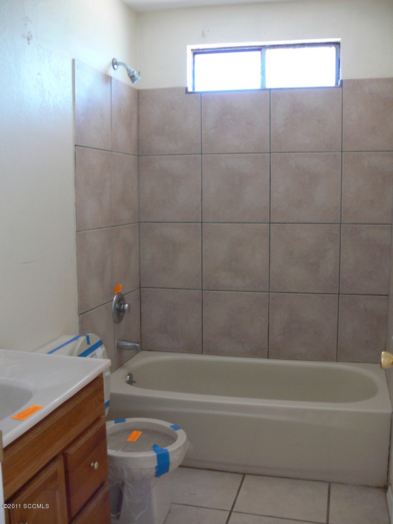 929 Via Puebla Rio Rico, AZ 85648 - Photo 9 of 13 a bathroom with a bathtub and a shower
