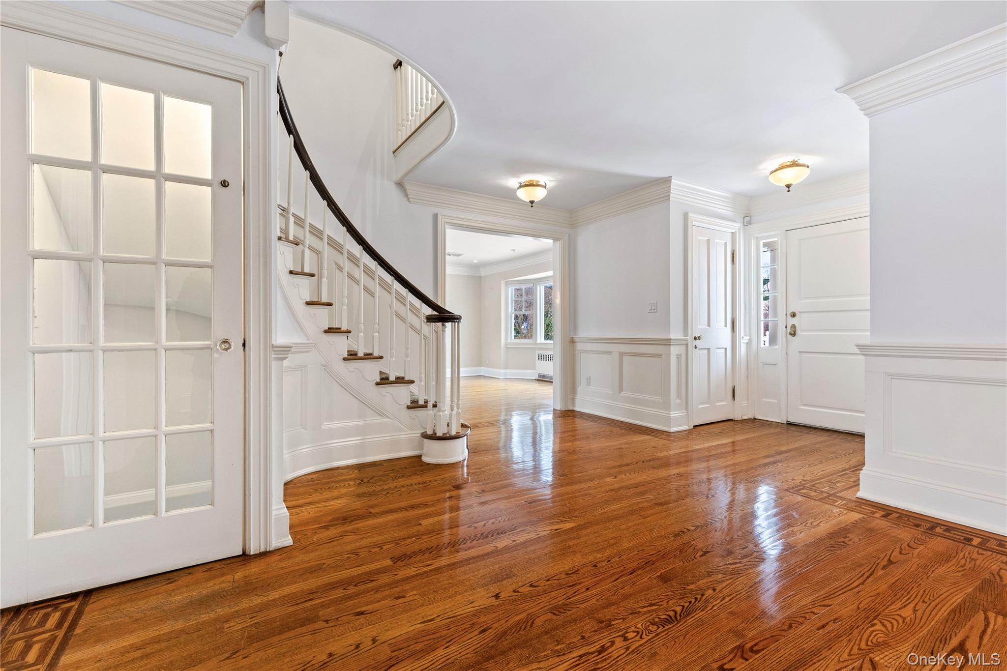 103 Pleasant Ridge Road Harrison, NY 10528 - Photo 2 of 39 Entry foyer features HDWD floors, crown molding, and wainscoting