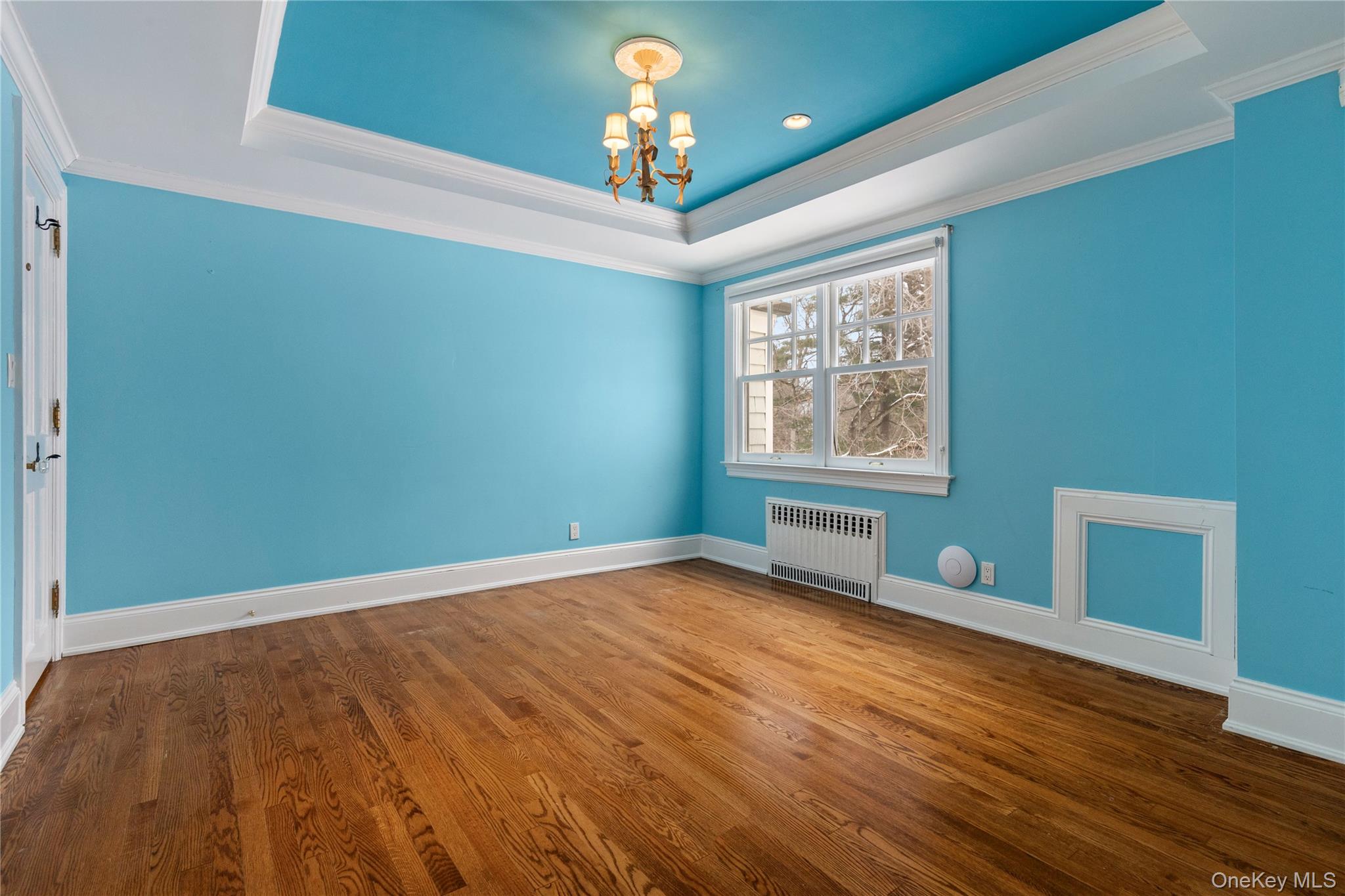 103 Pleasant Ridge Road Harrison, NY 10528 - Photo 29 of 39 Bedroom/nursery features tray ceiling, crown molding, and HDWD floors