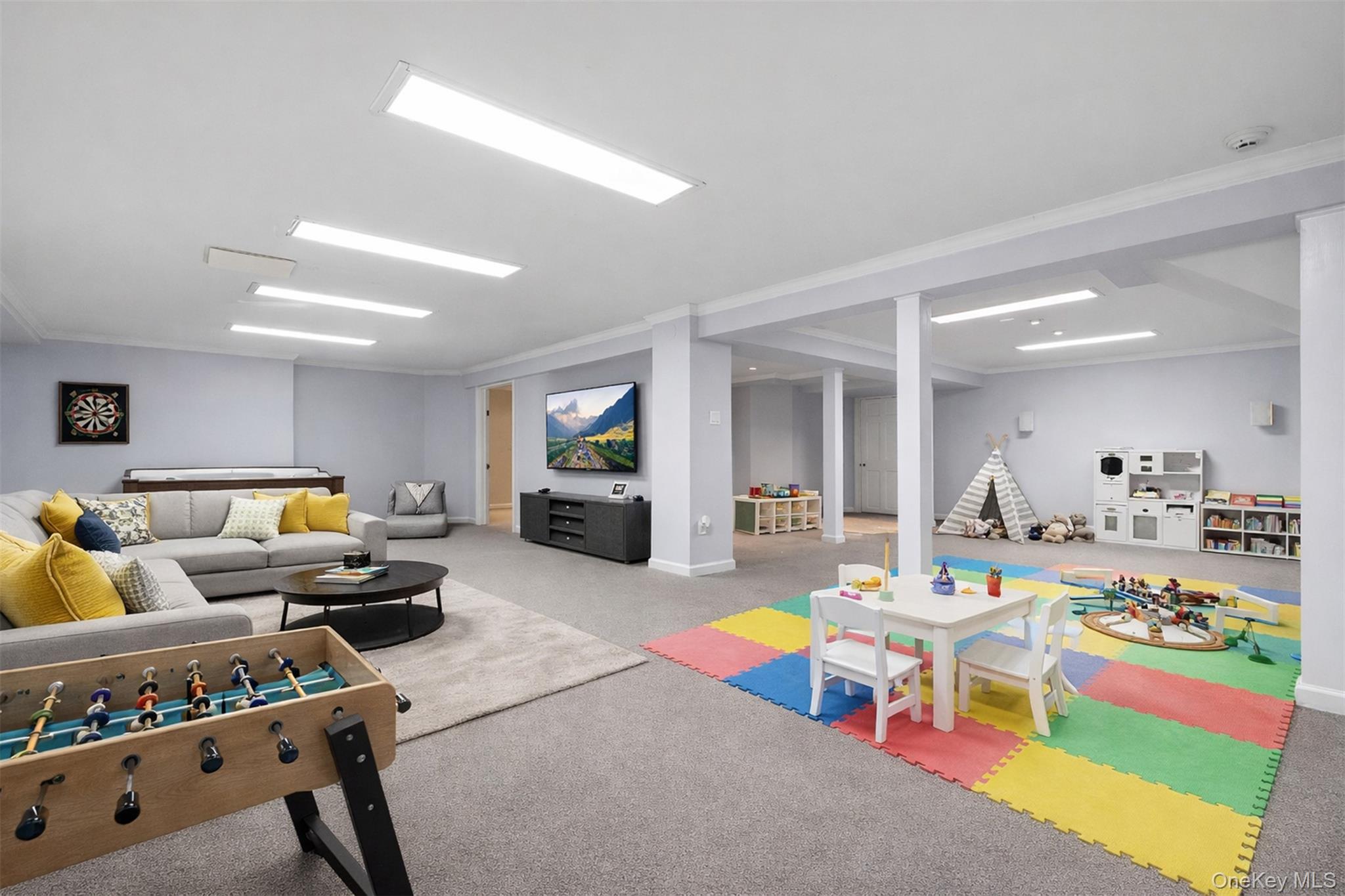 103 Pleasant Ridge Road Harrison, NY 10528 - Photo 31 of 39 Digitally Staged: Lower level multi-use recreational space