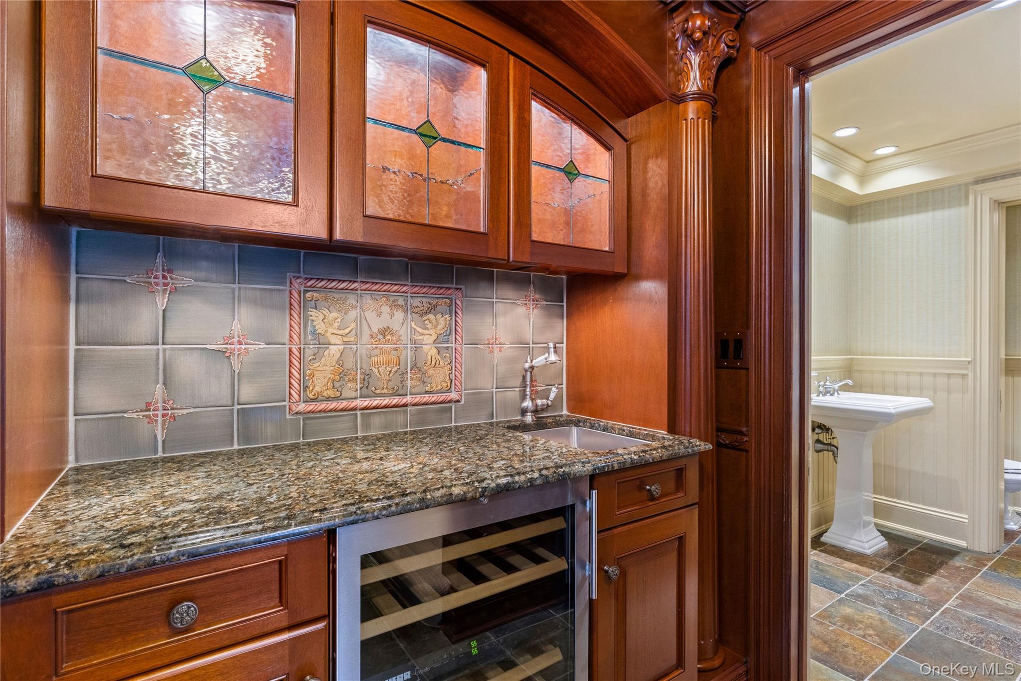 103 Pleasant Ridge Road Harrison, NY 10528 - Photo 6 of 39 Mahogany library includes a private wet bar with glass insert cabinets, beverage refrigerator, and full bath with changing area. (Not pictured back stairs to primary bedroom suite)