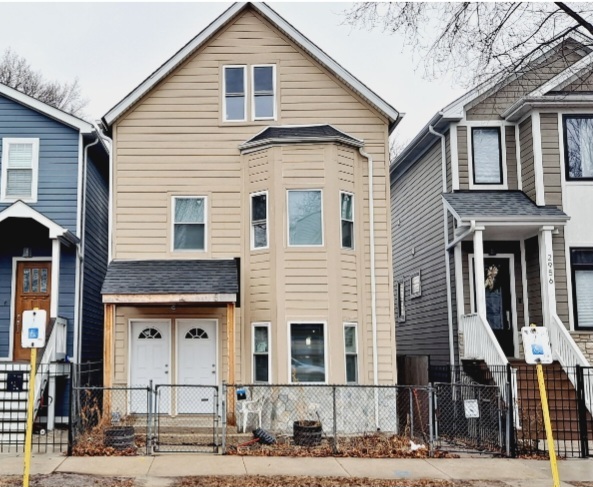 2958 West Nelson Street Chicago, IL 60618 - Photo 1 of 1 a view of a white building among the street