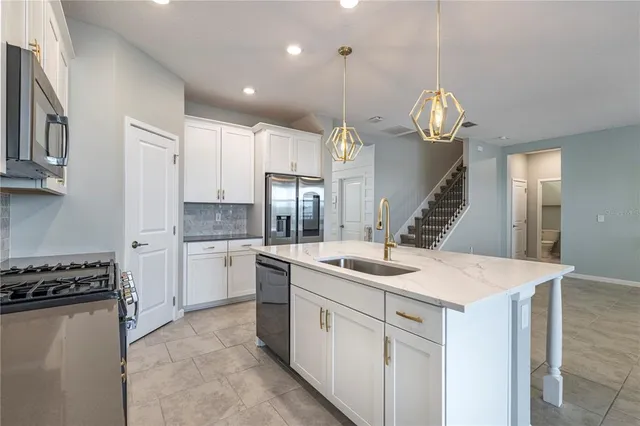 a view of an empty room with a window and a flat screen tv