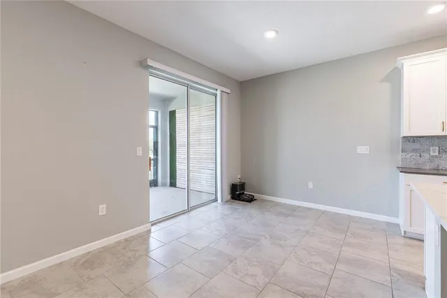 a living room with furniture and a lamp