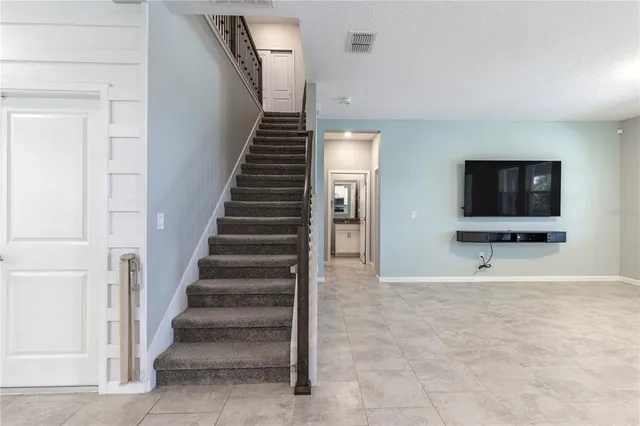 a view of an empty room and closet area