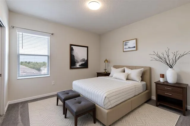 an aerial view of a house with outdoor space and a swimming pool