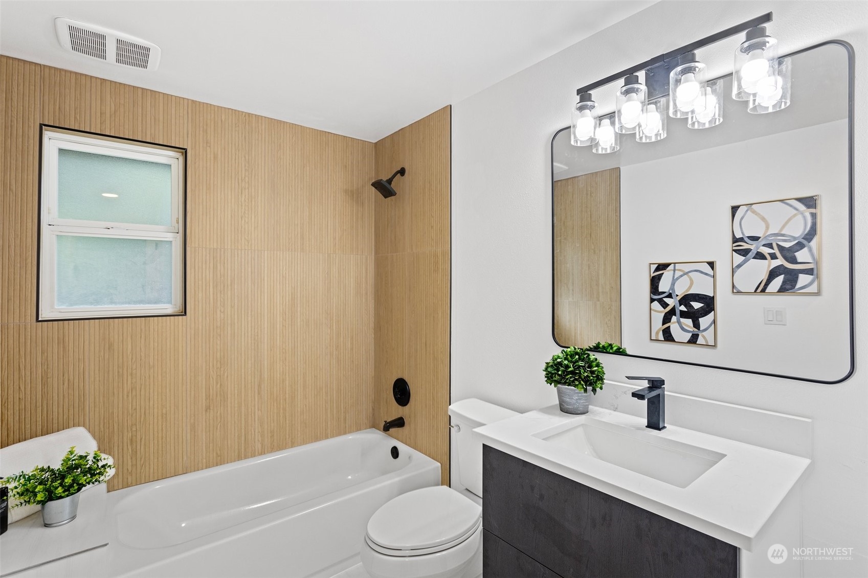 4714 200th Street Southeast Bothell, WA 98012 - Photo 8 of 27 a bathroom with a sink a toilet and tub