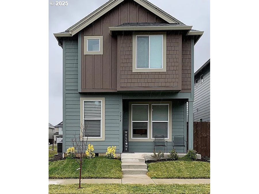 7026 South Ridge Way Ridgefield, WA 98642 - Photo 1 of 1 a front view of a house with garden