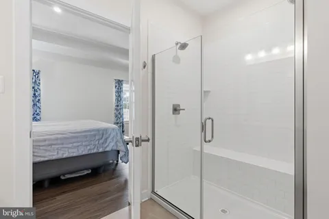 a bathroom with a tub and shower
