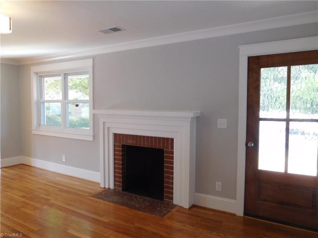 3545 Milhaven Road Winston-Salem, NC 27106 - Photo 3 of 30 Beautiful Hardwoods throughout, Fresh Paint, new Fixtures and Archways for added Charm. Formal Living has brick FP. Fireplace & Chimney are SOLD AS IS.
