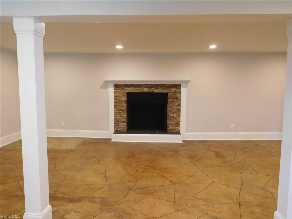 3545 Milhaven Road Winston-Salem, NC 27106 - Photo 25 of 30 Rock surround on Fireplace. Detailed concrete floors.