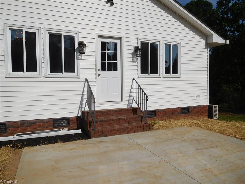 3545 Milhaven Road Winston-Salem, NC 27106 - Photo 29 of 30 Side View. Door walks out to large Patio. This home has great outdoor entertaining space.