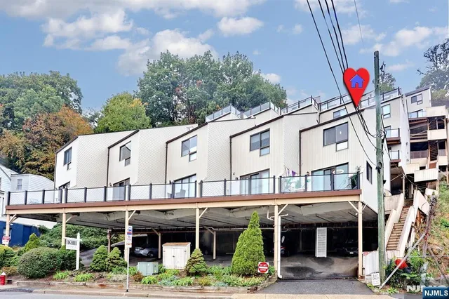 a front view of building with retail shops