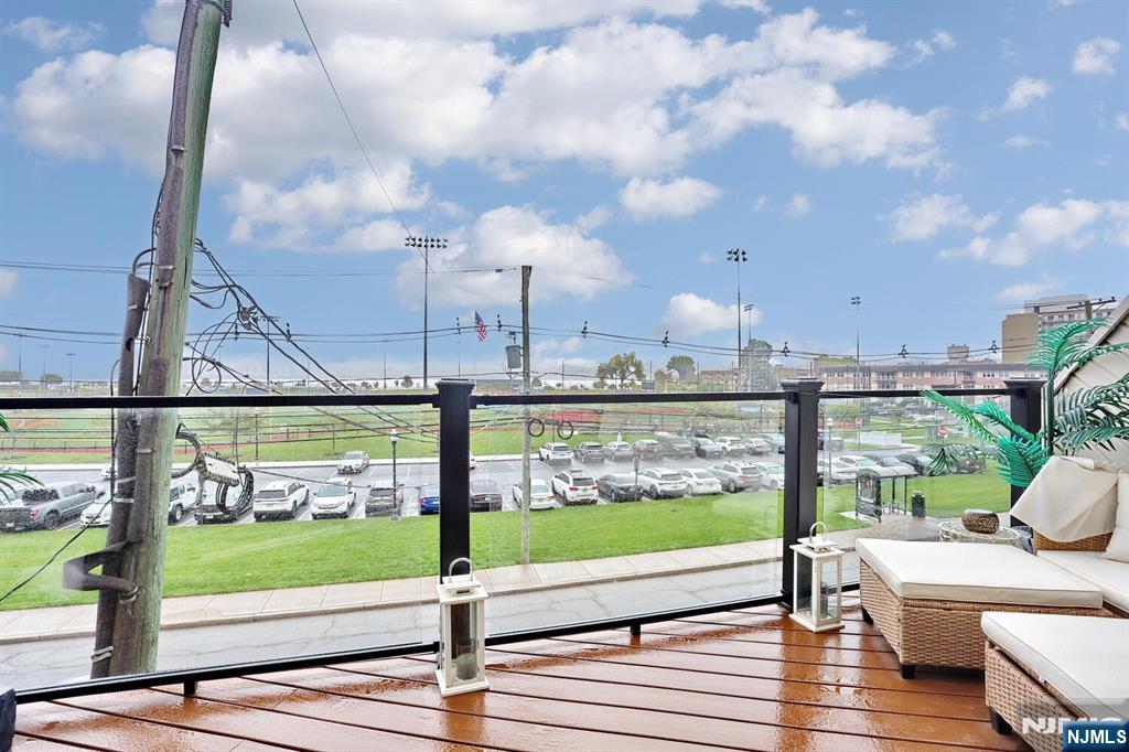 1110 River Road, Unit 105 Edgewater, NJ 07020 - Photo 4 of 19 a view of a terrace with wooden floor