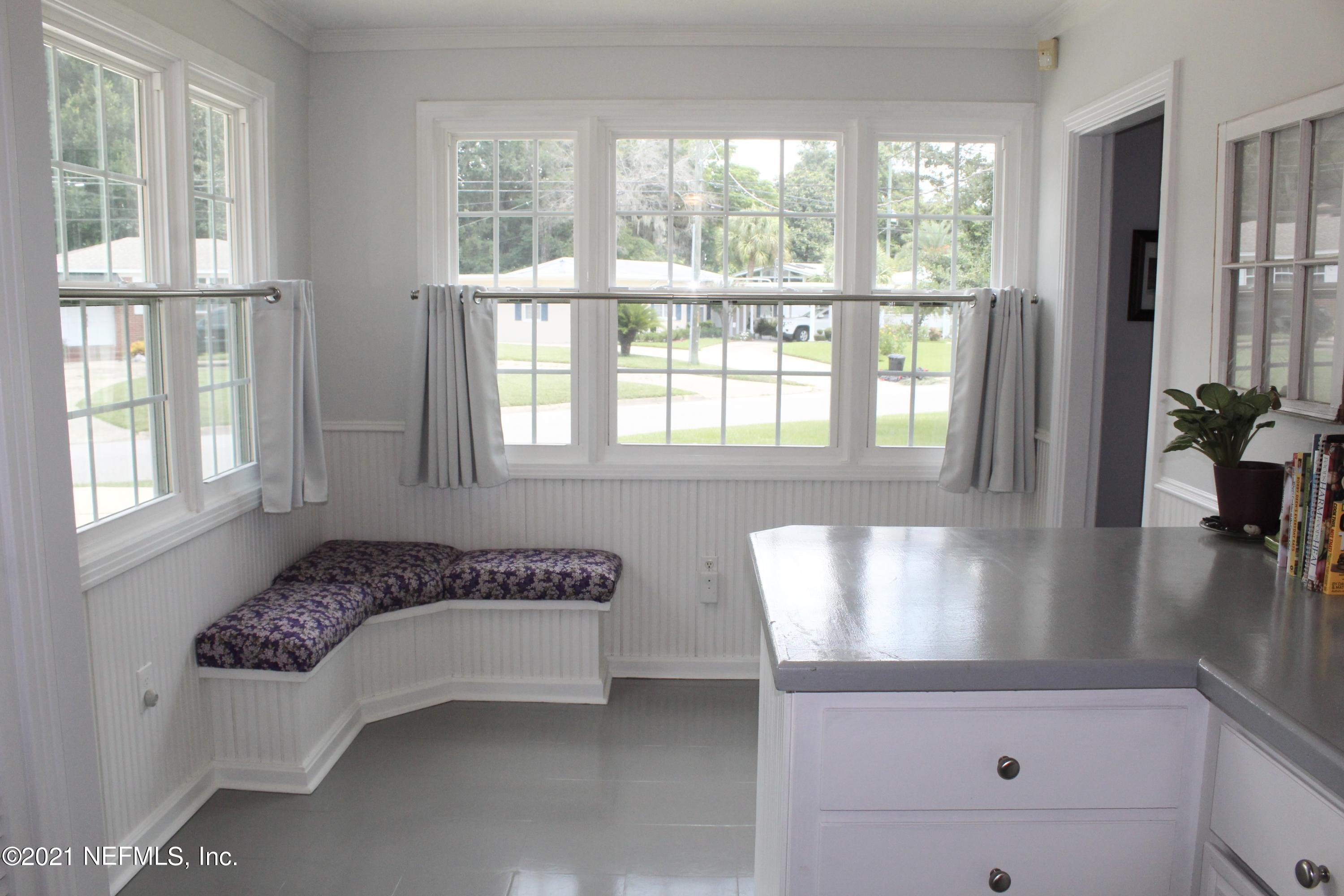 1840 Cornell Road Jacksonville, FL 32207 - Photo 12 of 24 a spacious bedroom with a bed and a window