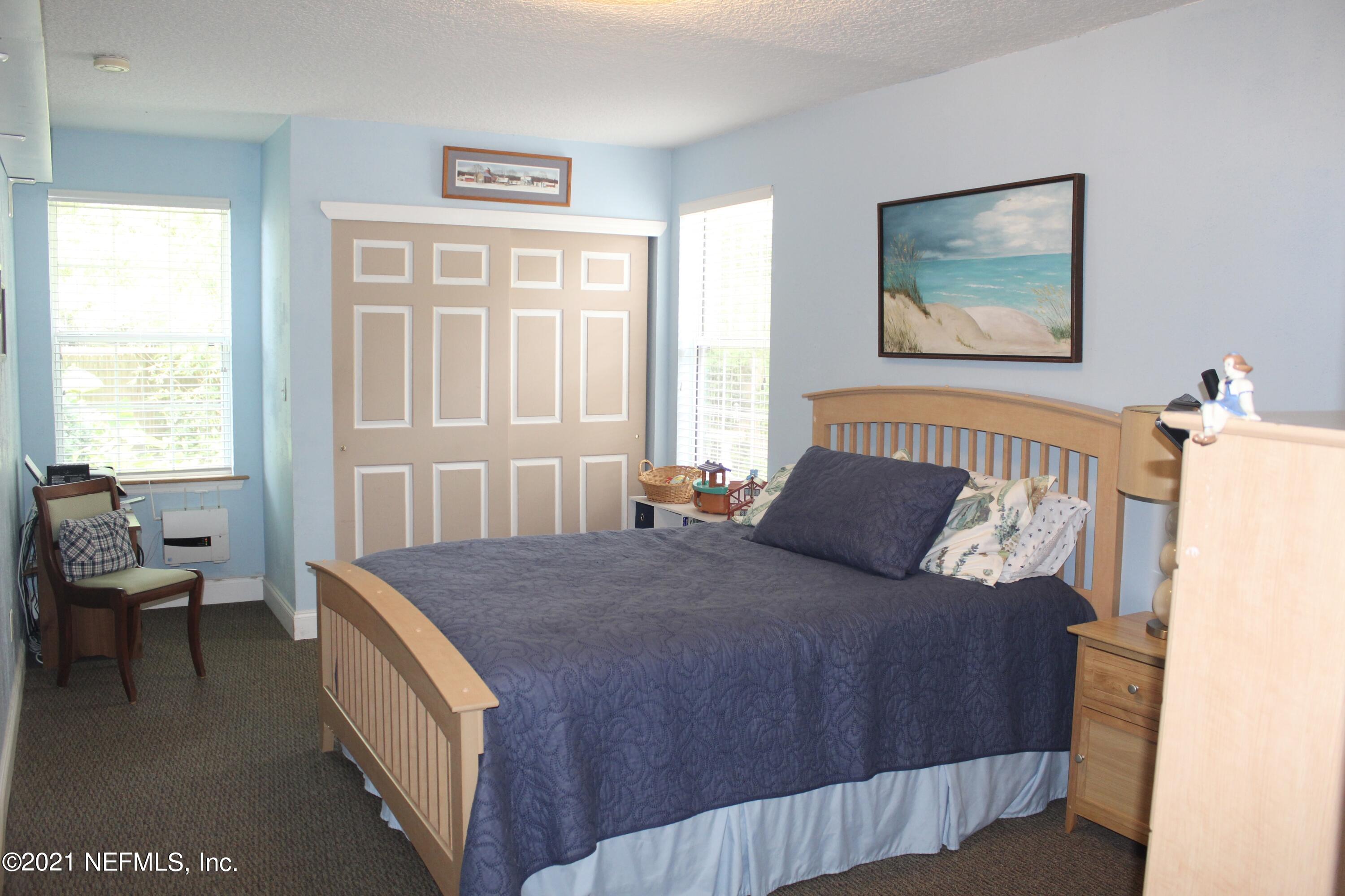 1840 Cornell Road Jacksonville, FL 32207 - Photo 14 of 24 a bed room with a bed and a chair