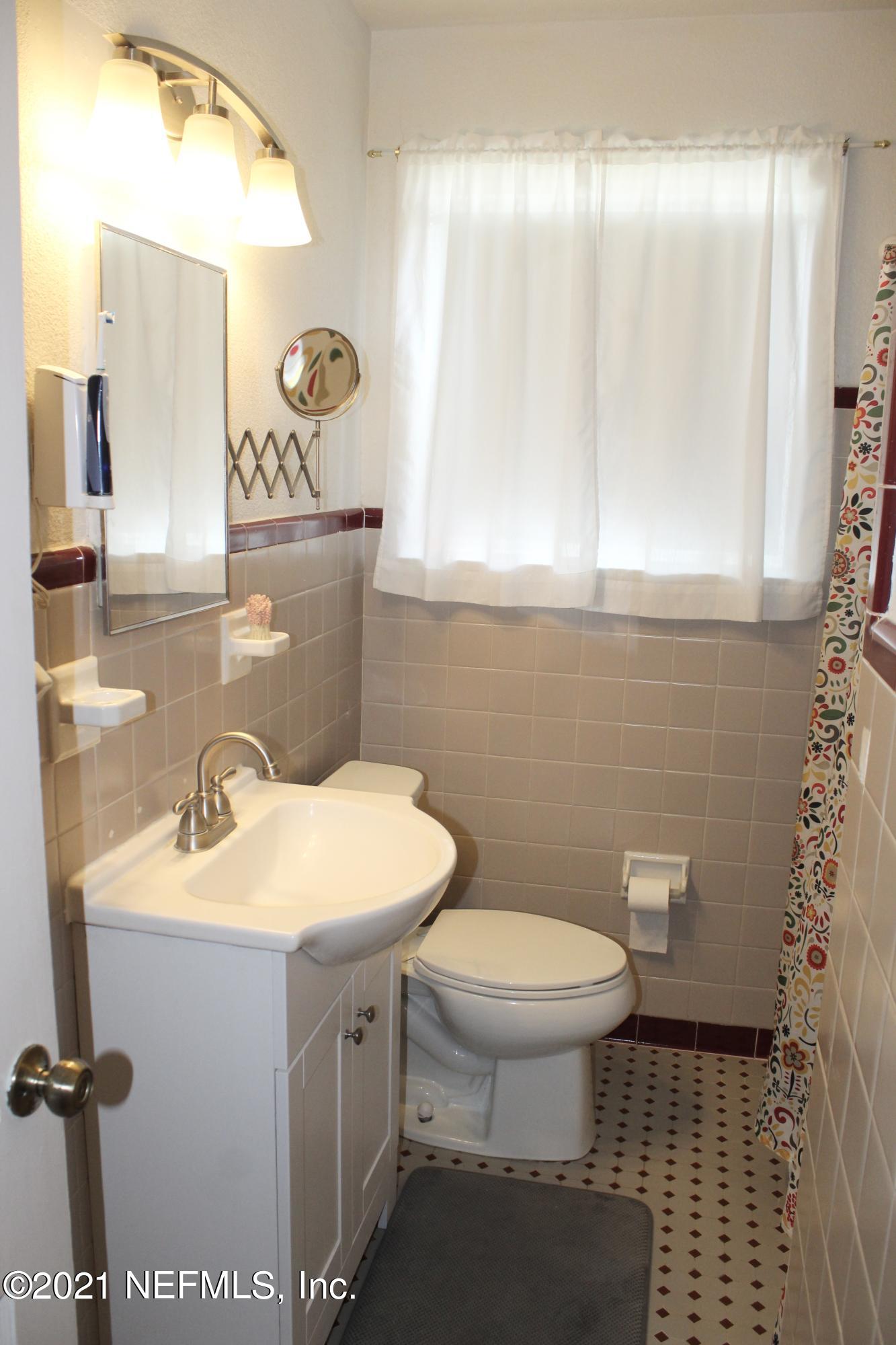 1840 Cornell Road Jacksonville, FL 32207 - Photo 17 of 24 a bathroom with a sink toilet and mirror