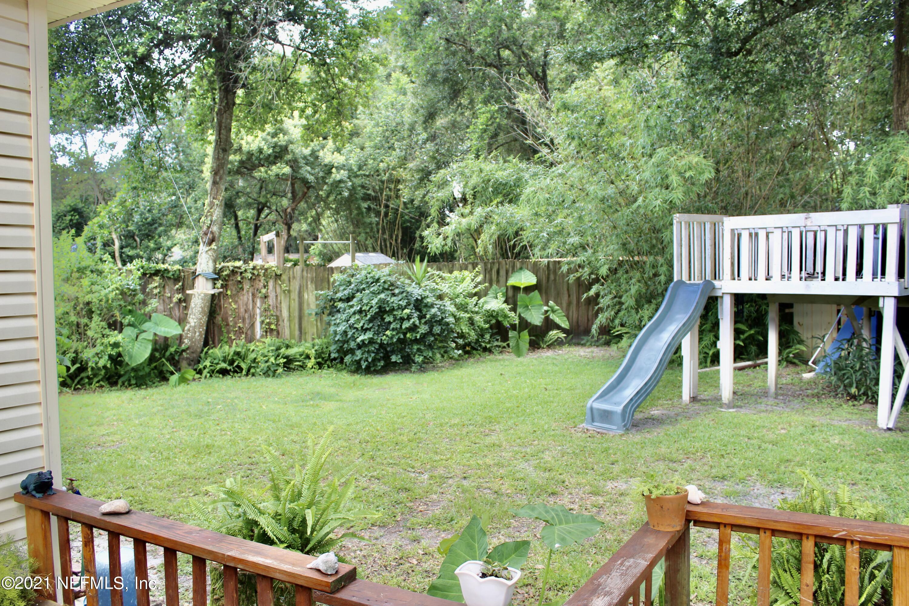 1840 Cornell Road Jacksonville, FL 32207 - Photo 21 of 24 a view of a wooden deck and a backyard
