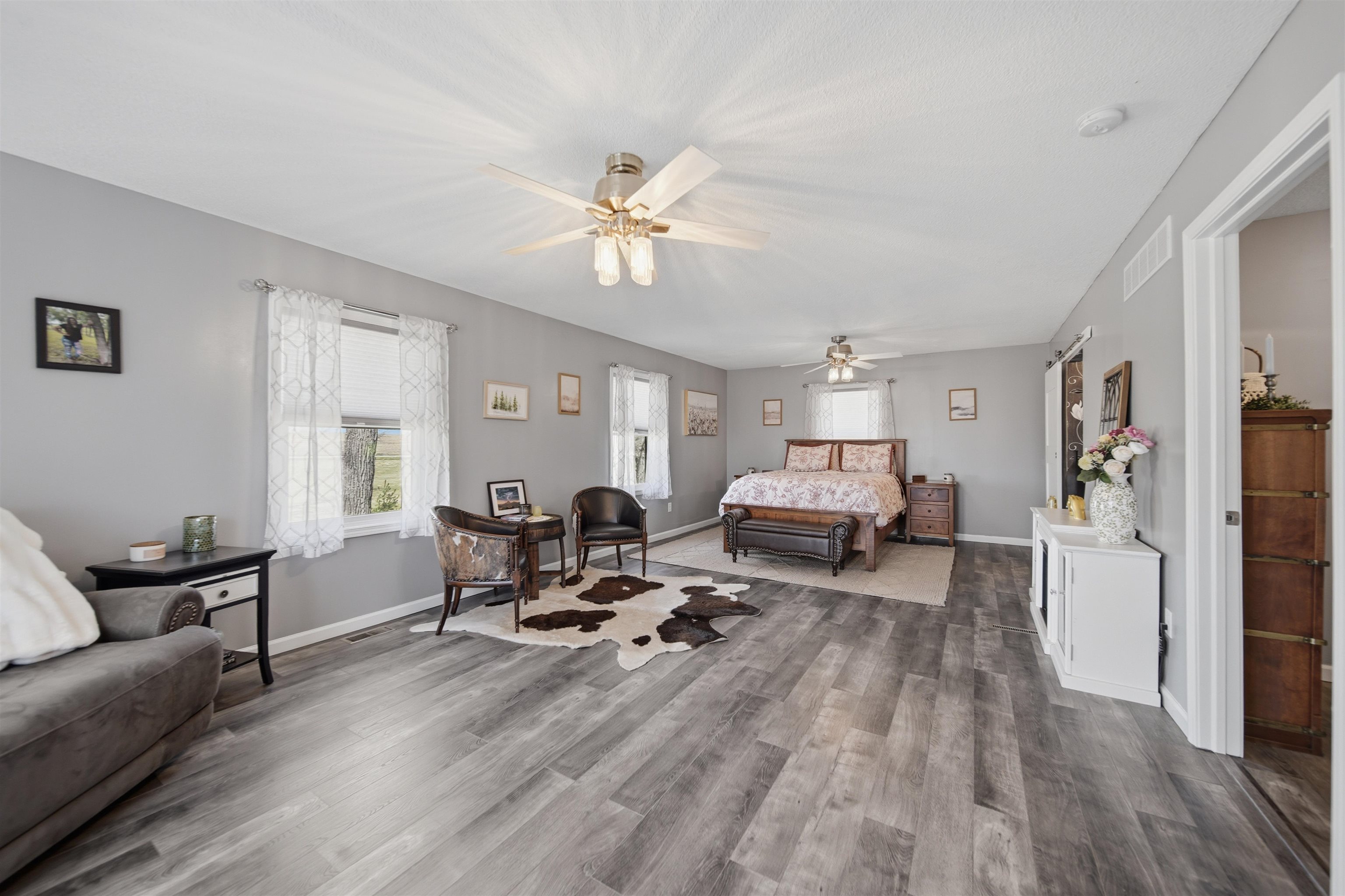 5287 East Canfield (5 Ac) Road Chana, IL 61015 - Photo 12 of 45 a living room with furniture window and a wooden floor