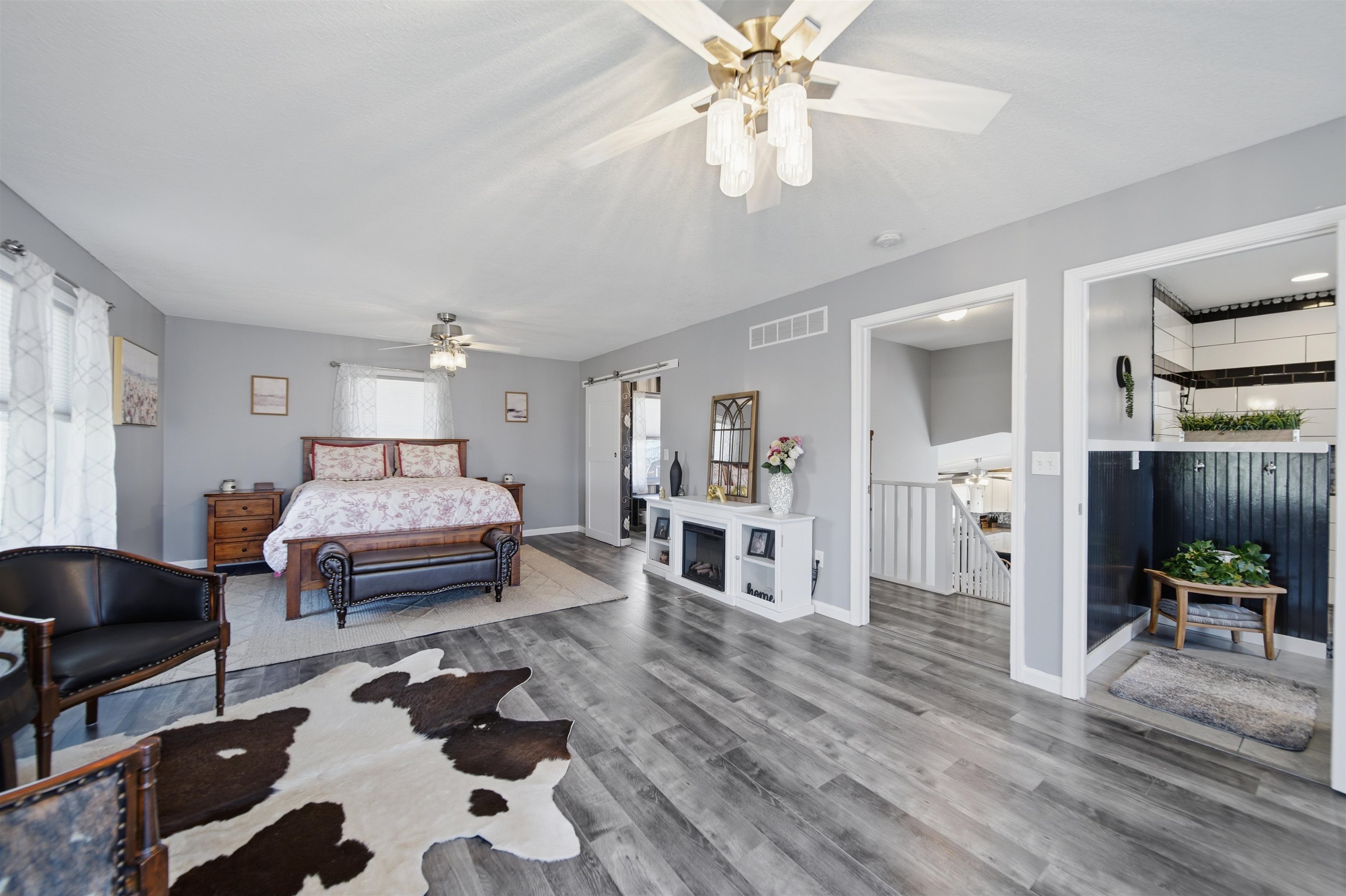 5287 East Canfield (5 Ac) Road Chana, IL 61015 - Photo 13 of 45 a bedroom with furniture and a chandelier