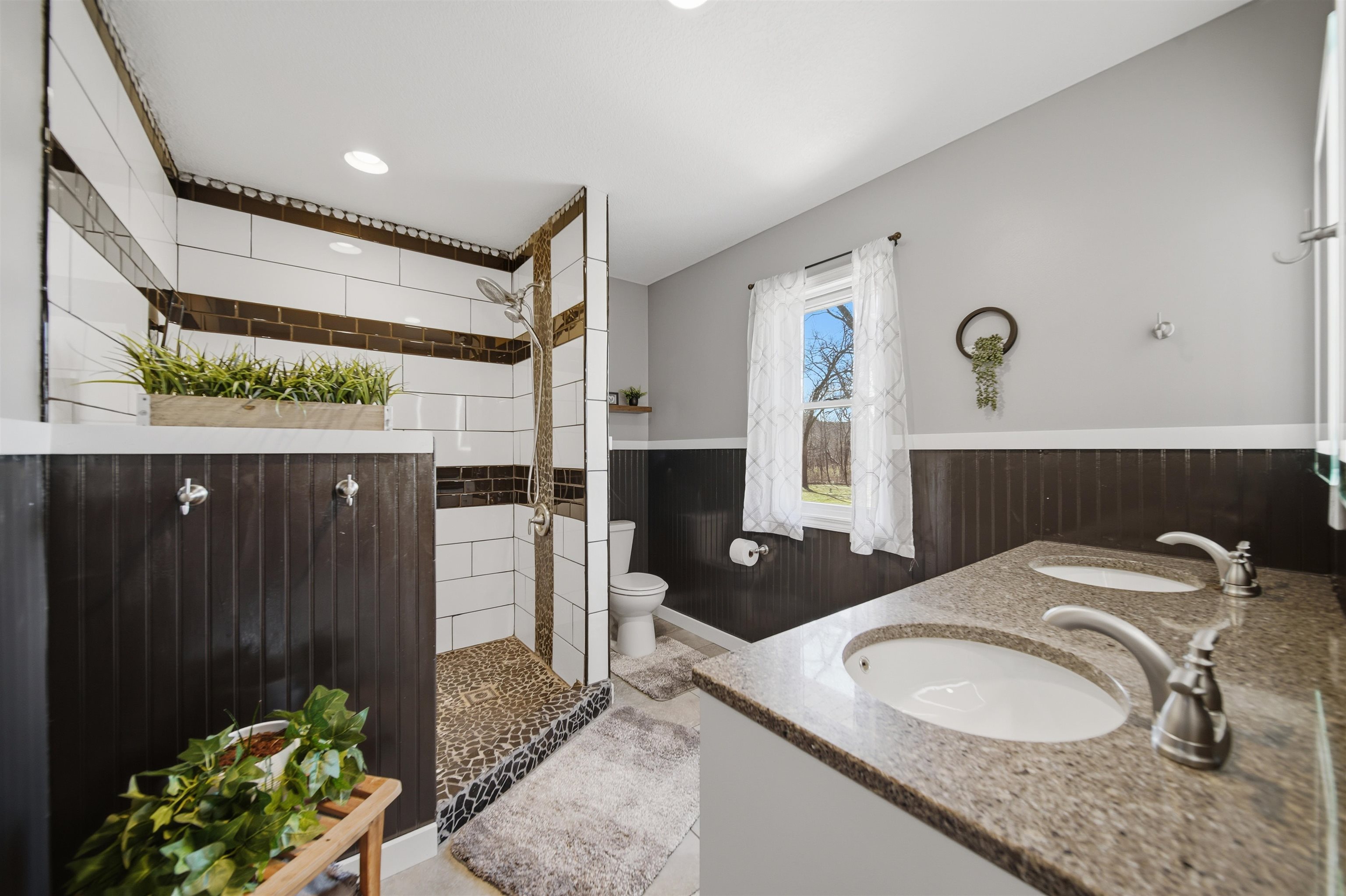 5287 East Canfield (5 Ac) Road Chana, IL 61015 - Photo 14 of 45 a bathroom with a granite countertop sink a mirror and shower