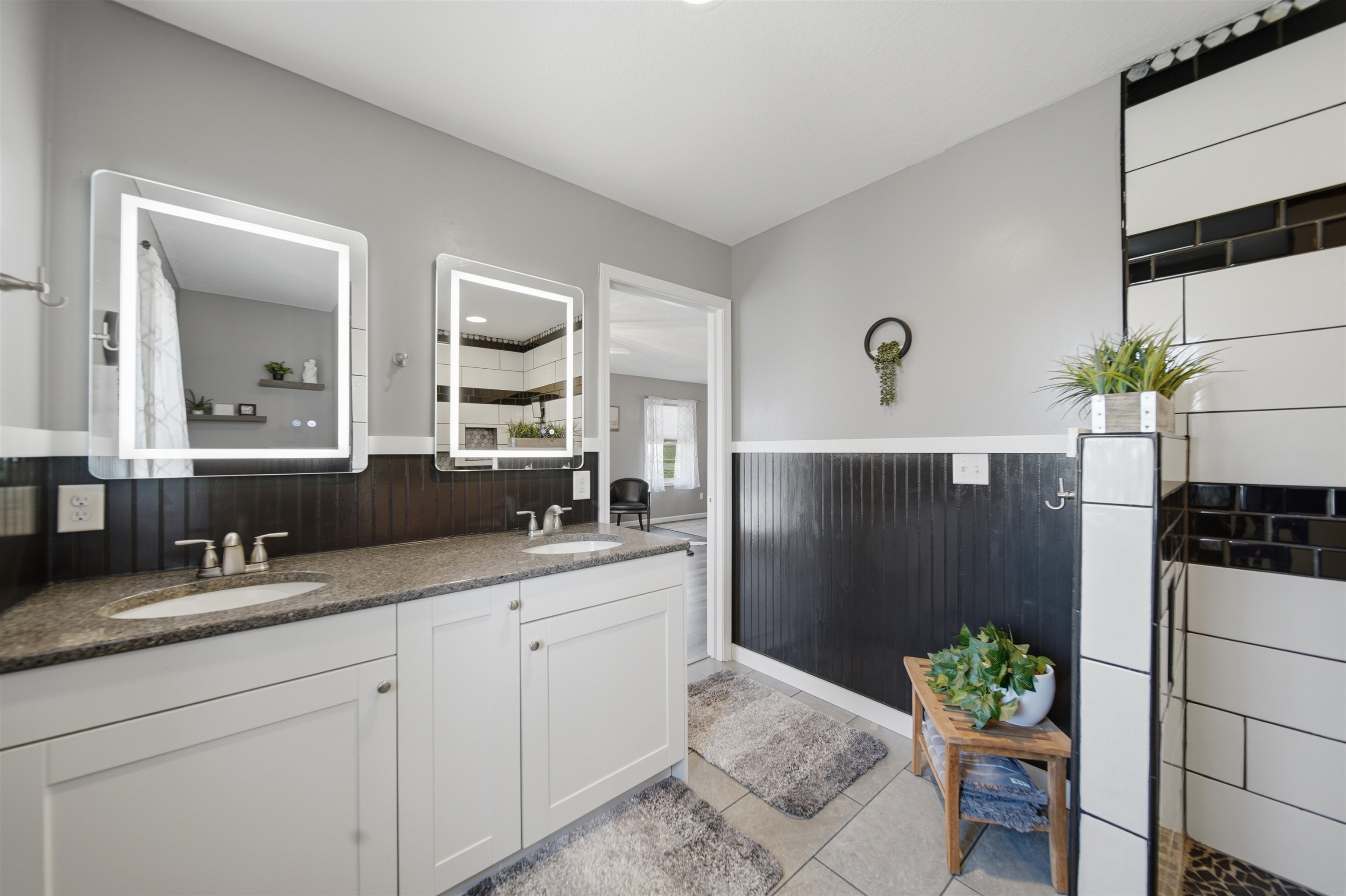 5287 East Canfield (5 Ac) Road Chana, IL 61015 - Photo 15 of 45 a bathroom with a double vanity sink and mirror