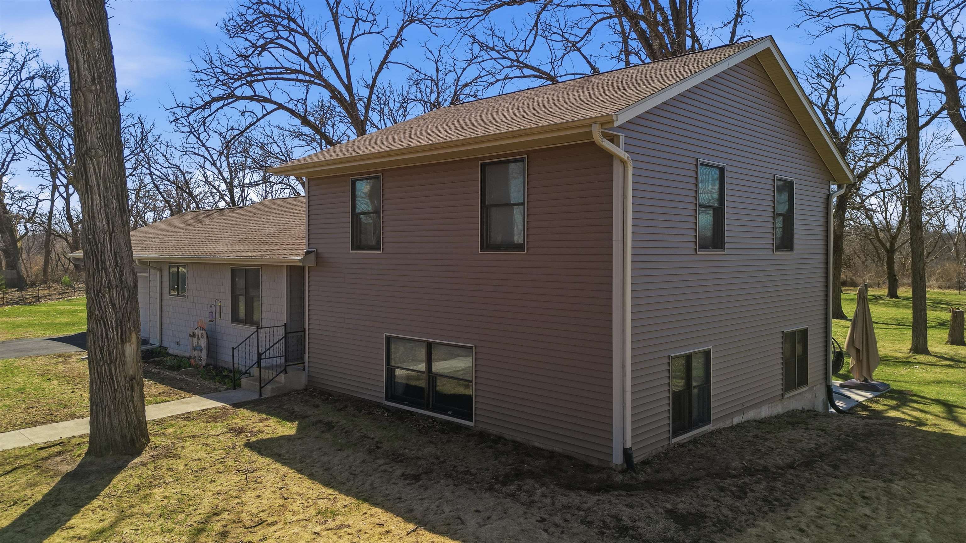 5287 East Canfield (5 Ac) Road Chana, IL 61015 - Photo 32 of 45 a view of a house with a yard