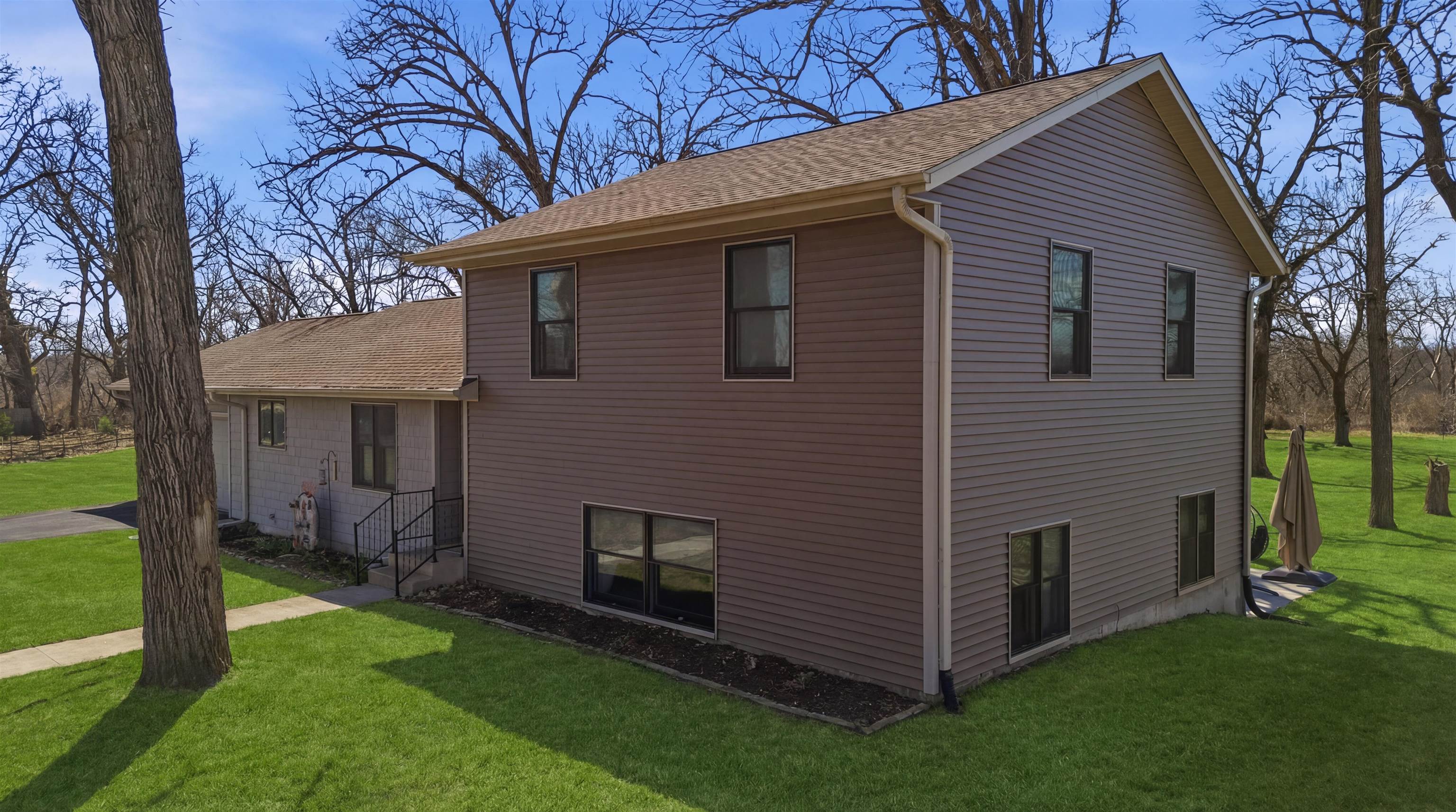 5287 East Canfield (5 Ac) Road Chana, IL 61015 - Photo 33 of 45 front view of a house with a yard