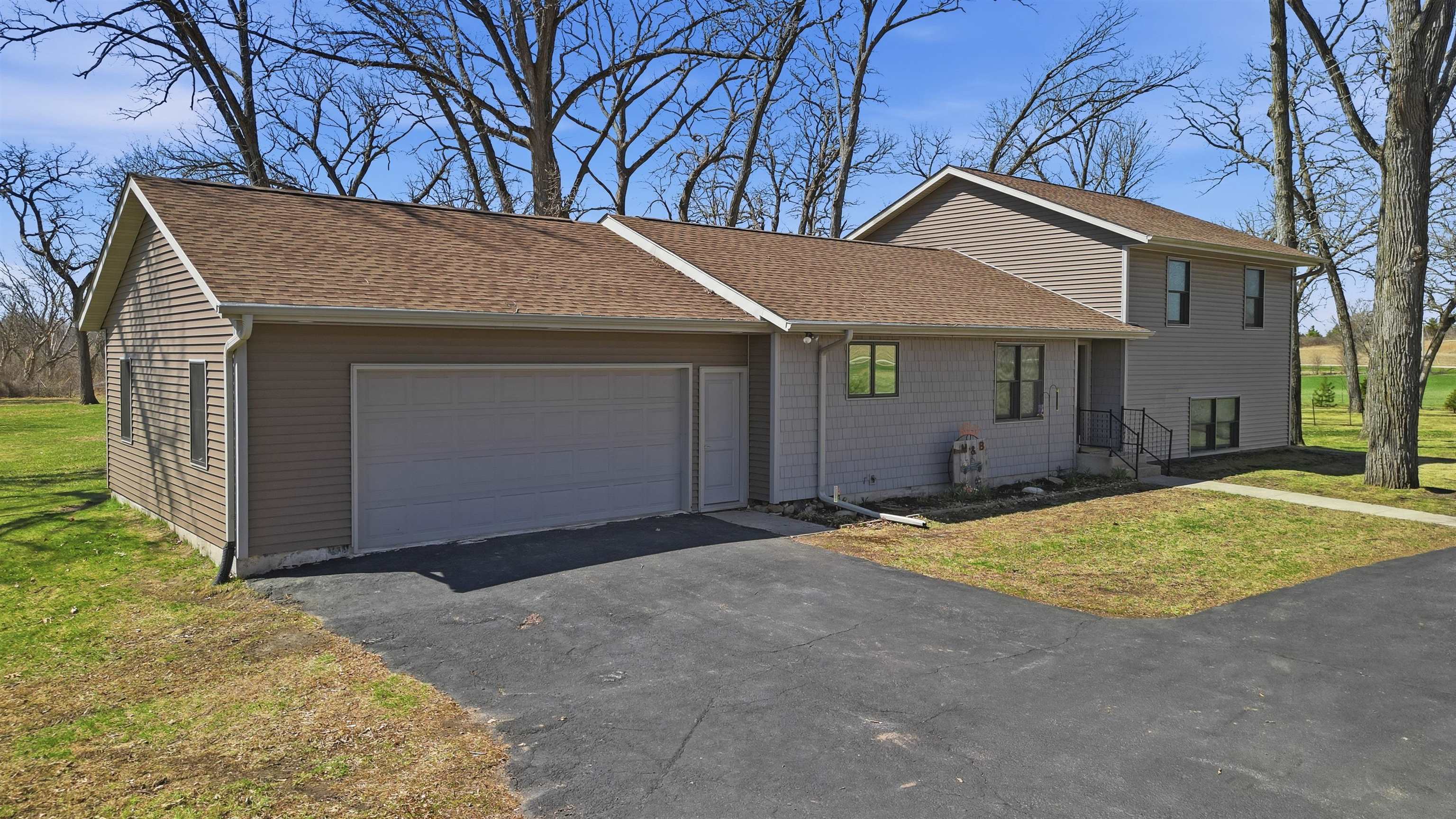 5287 East Canfield (5 Ac) Road Chana, IL 61015 - Photo 35 of 45 a front view of house with yard