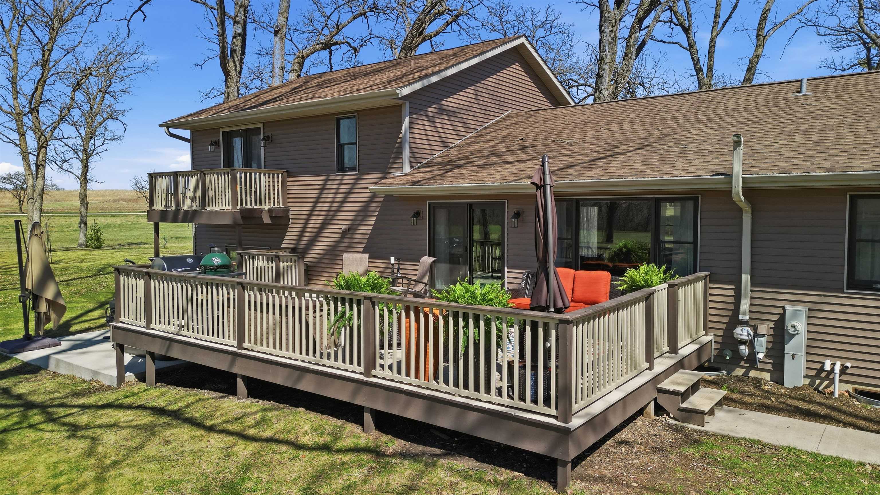5287 East Canfield (5 Ac) Road Chana, IL 61015 - Photo 41 of 45 a view of a house with wooden floor roof and a yard