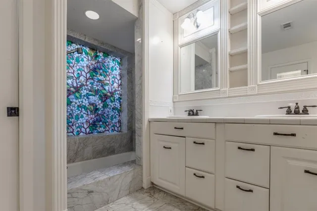 a bathroom with a sink and a mirror