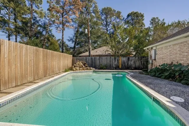 a swimming pool with a garden view