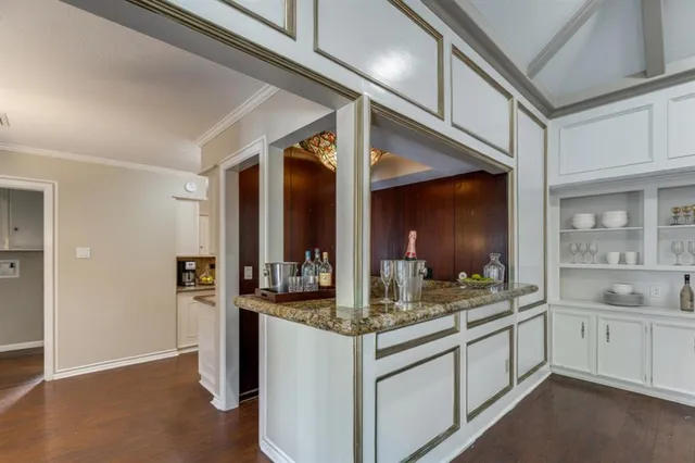 a kitchen with stainless steel appliances granite countertop a sink and cabinets