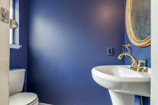 a bathroom with a toilet and a sink