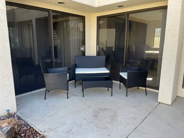 a view of a livingroom with furniture and a bench
